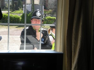 Peek-a-boo: Police having a nose through a window of the Beechwood Hotel